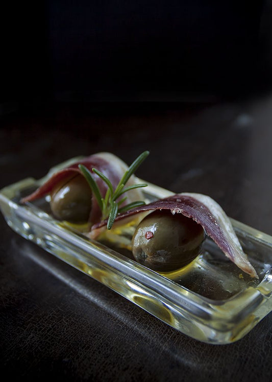 Spanish Tapas: Marinated Green Olives with Duck Prosciutto - Angel's Salumi & Truffles