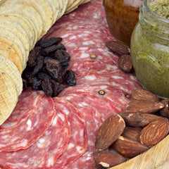 Angel’s Salumi and Truffles – Pre-Sliced French Rosette Salami served on a Charcuterie Board with Baguette and Cheese