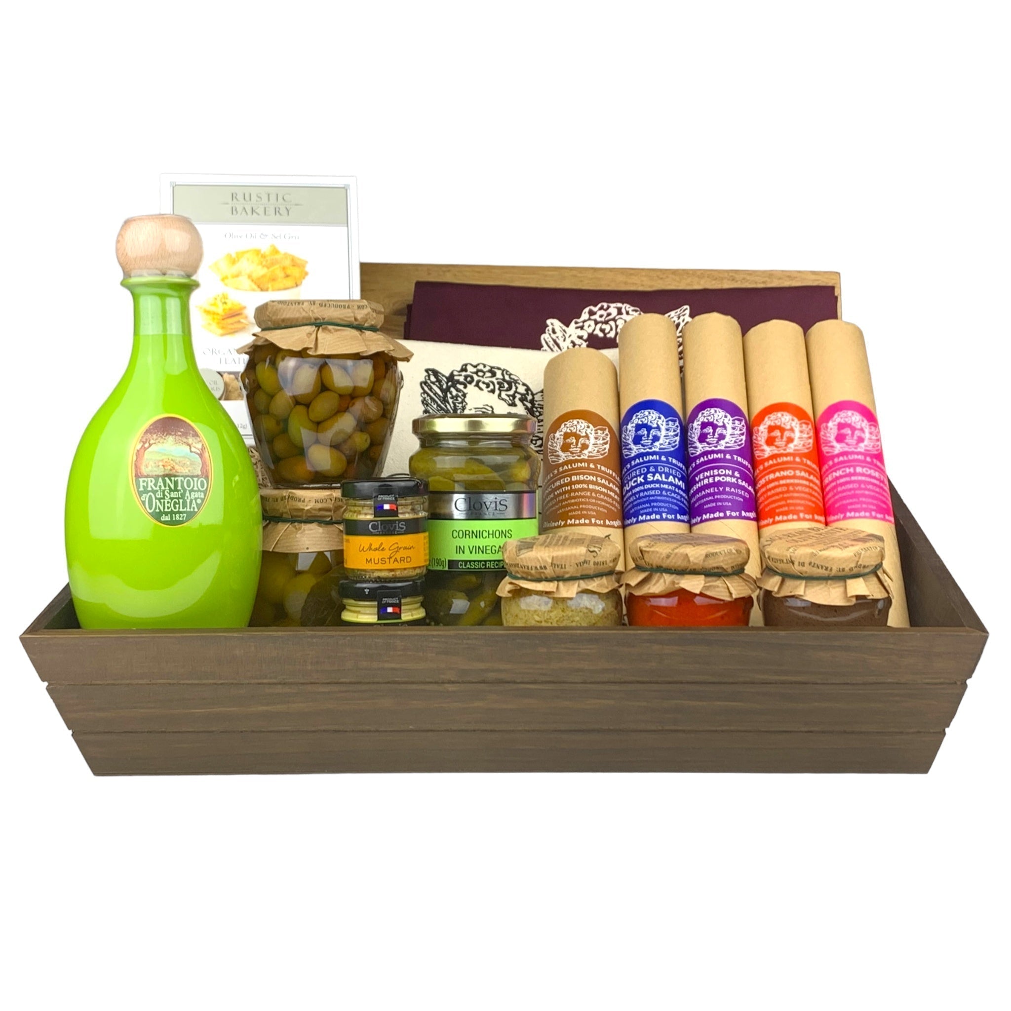 A dark wooden gift box filled with various antipasti and salami