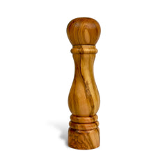 Wooden pepper grinder on a white background