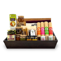 A gourmet charcuterie gift basket containing an assortment of dried fruits, nuts, spreads, olives, and salami, presented in a handcrafted wooden box with a knife and a cutting board.