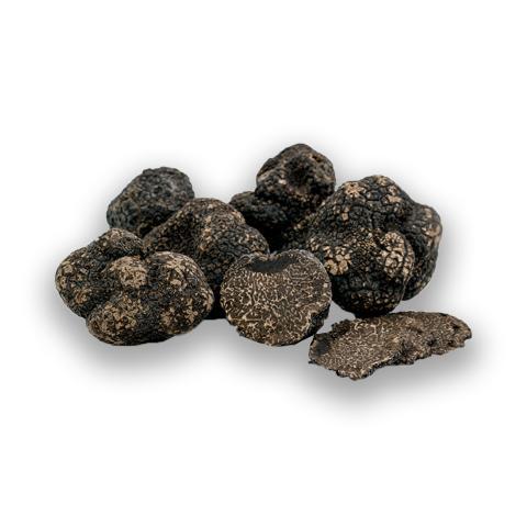 Flash-frozen whole Black Winter Truffle with dark, veined interior, preserved for year-round gourmet use.