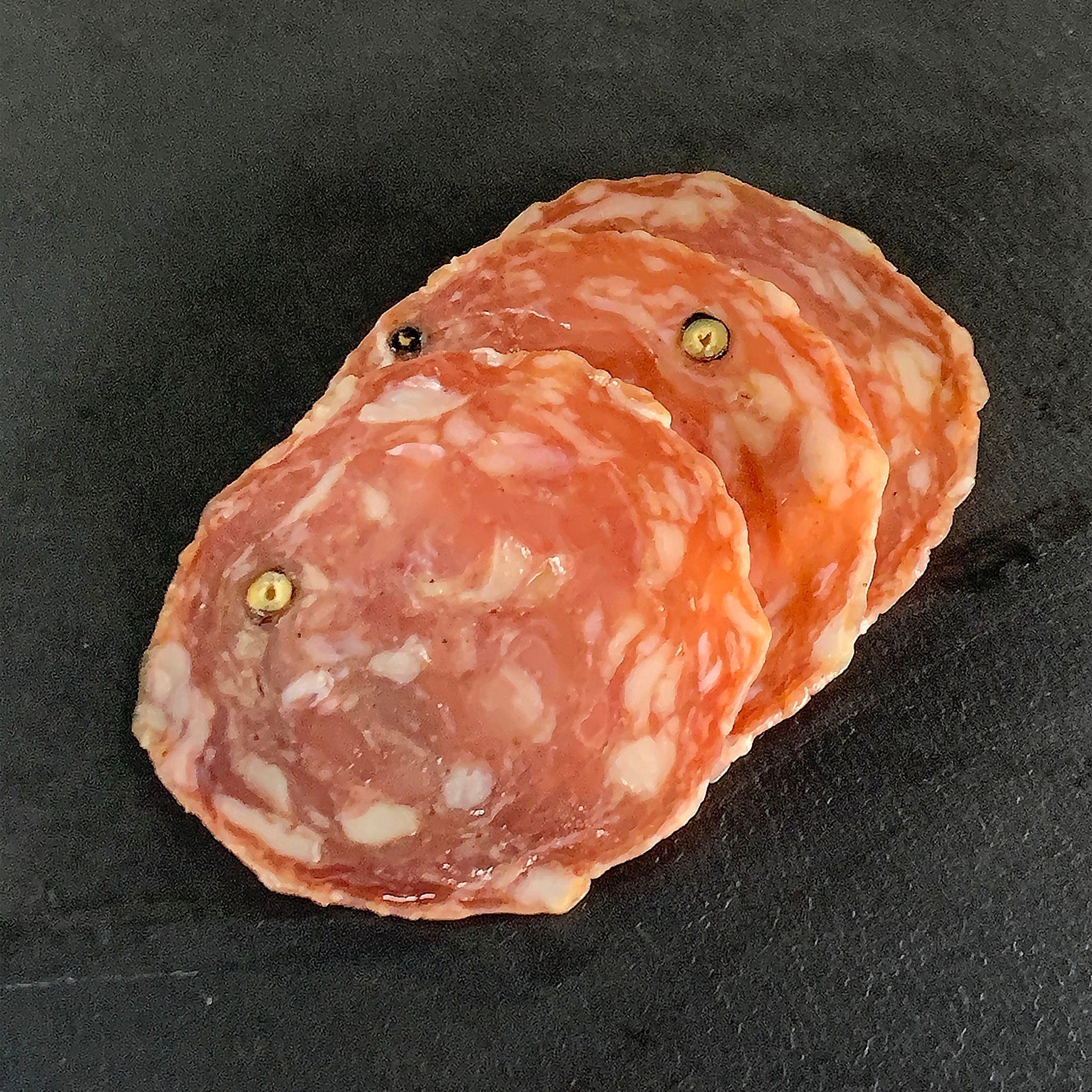 Detail shot of sliced nostrano salami 