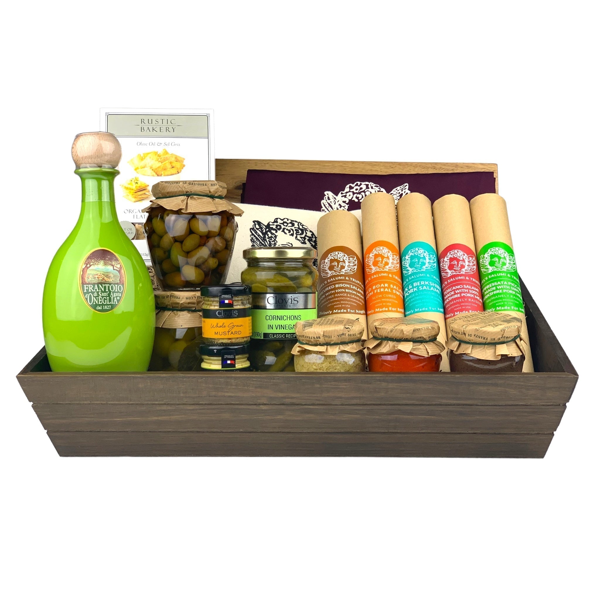 A dark wooden gift box filled with various antipasti and salami