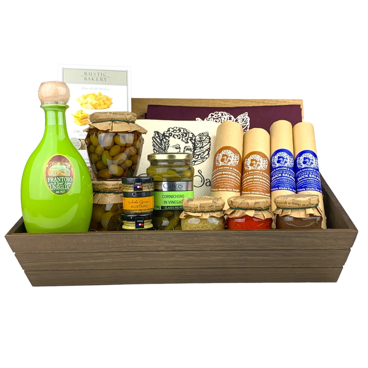 A dark wooden gift box filled with various antipasti and salami