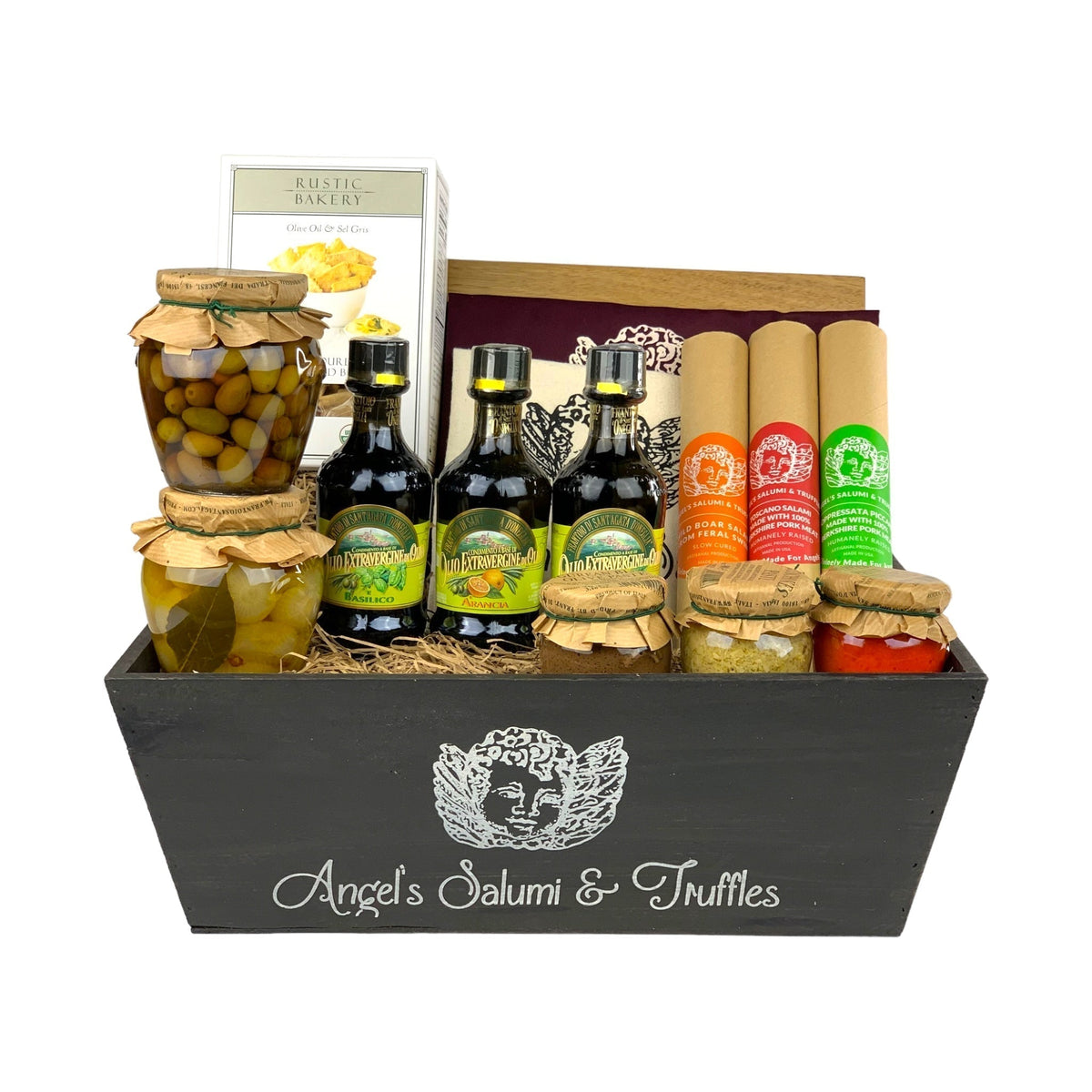 A dark wooden gift box filled with various antipasti and salami