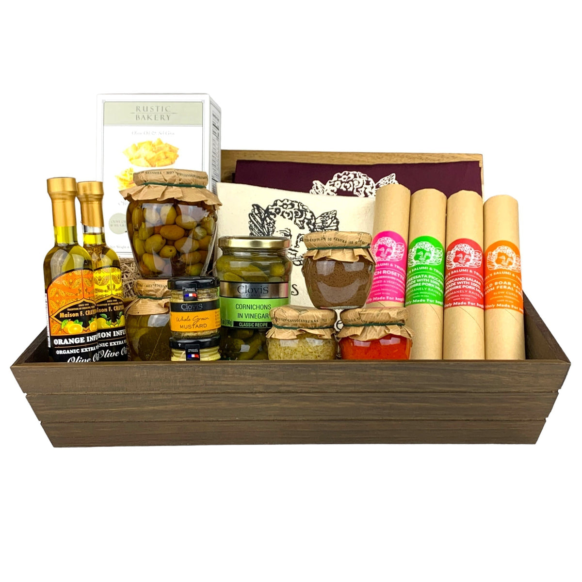 A dark wooden gift box filled with various antipasti and salami