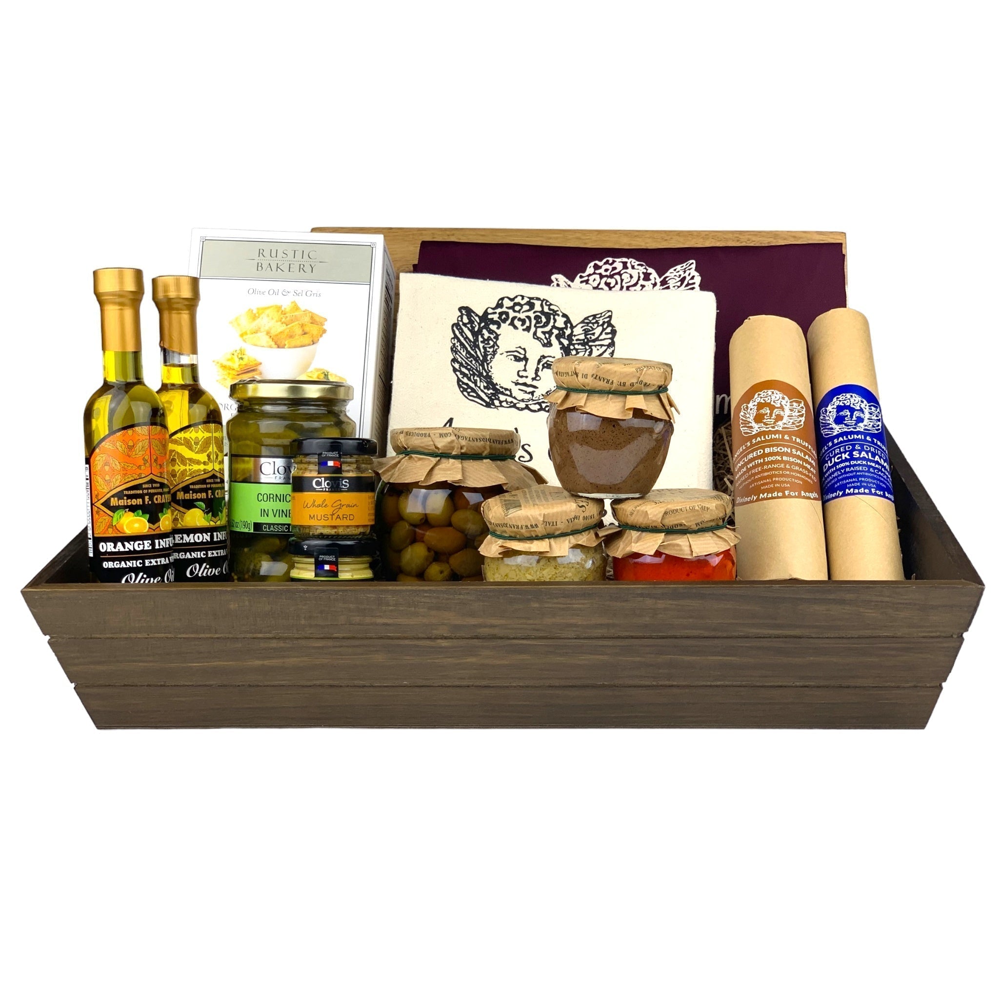 A dark wooden gift box filled with various antipasti and salami