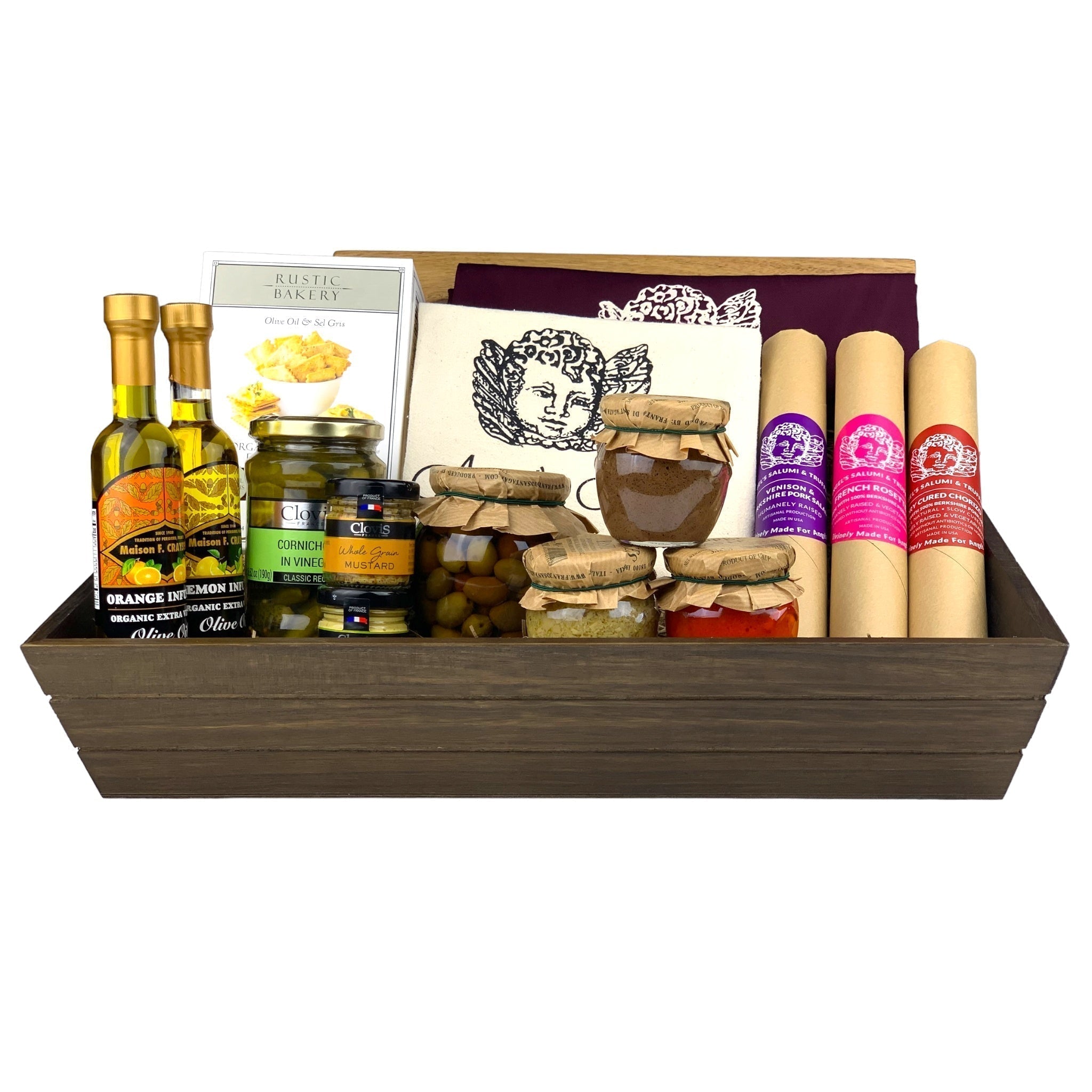 A dark wooden gift box filled with various antipasti and salami