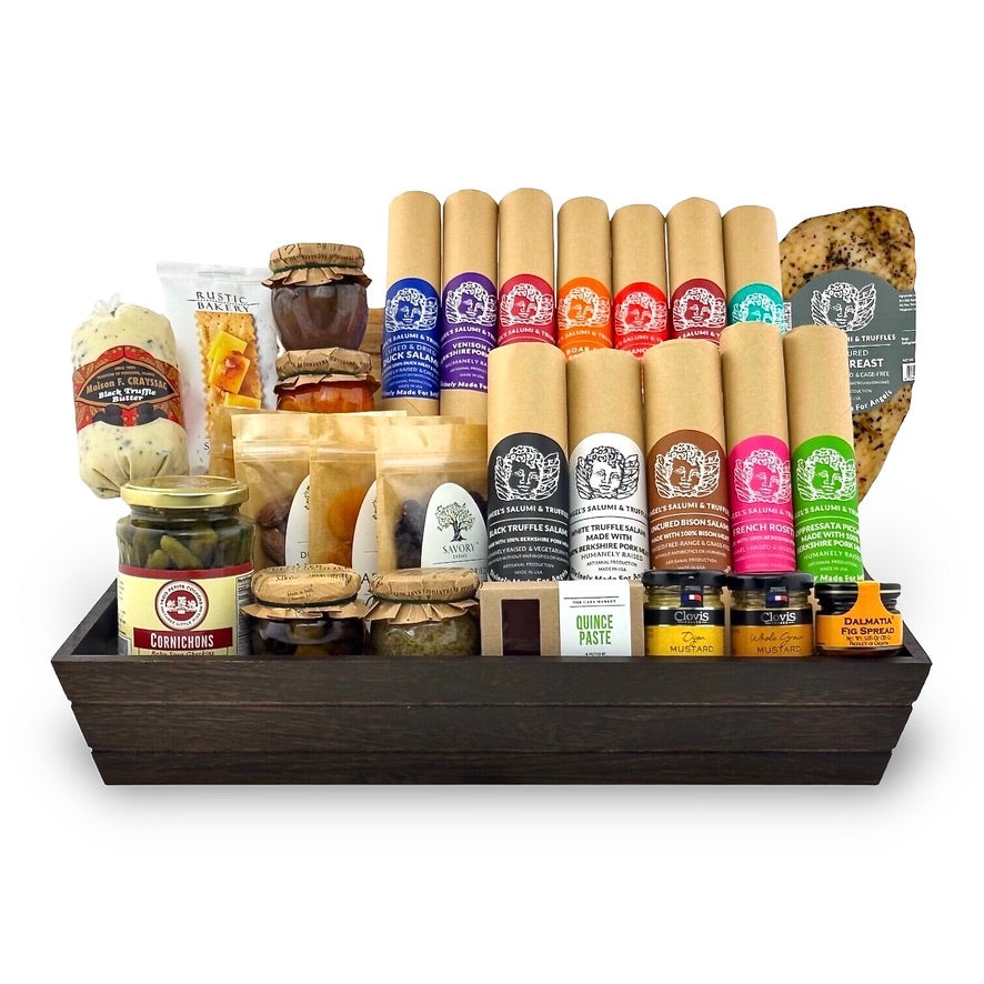 A charcuterie gift basket containing an assortment of meats, cheeses, and condiments, neatly arranged in a wooden box.