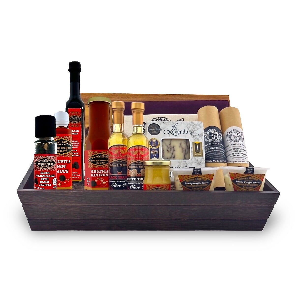 A gift basket containing various truffle-flavored food items, including bottles of sauce, oil, and vinegar, as well as packaged salami and butter, all displayed in a wooden box.